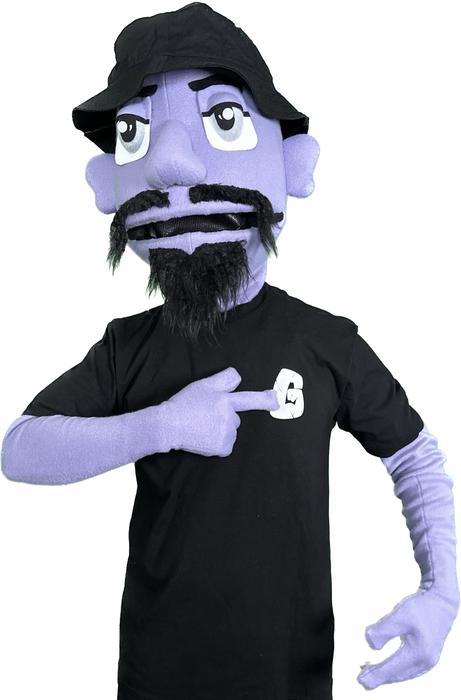 Puppet character pointing to logo patch on shirt