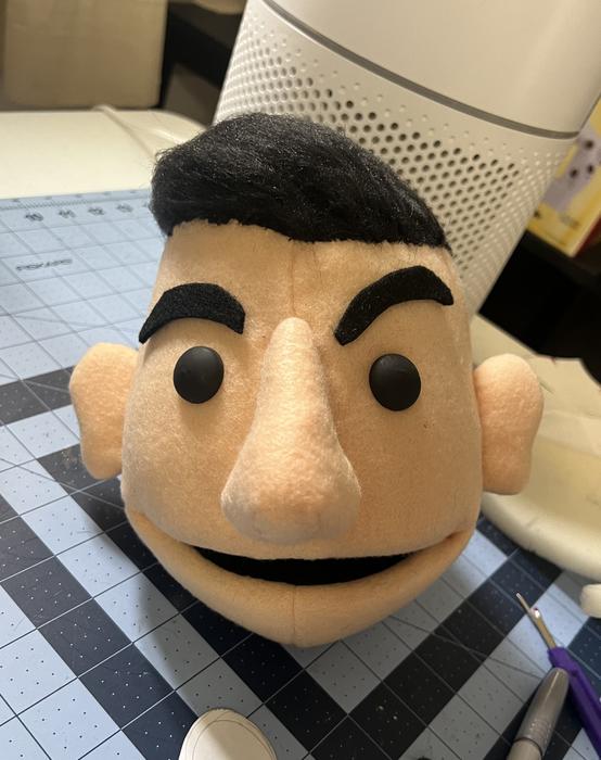 Puppet head build in progress on the workbench