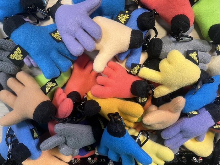Pile of colorful felt hand keychains