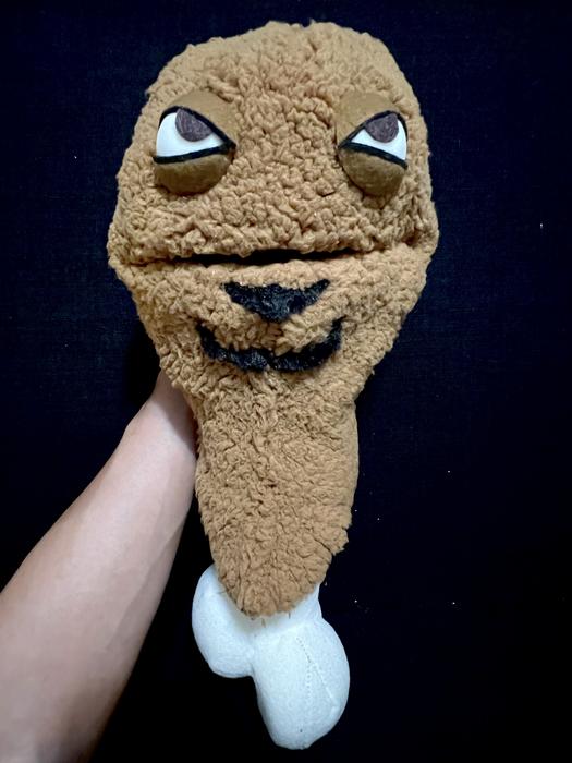 Close-up of a tan fuzzy puppet head